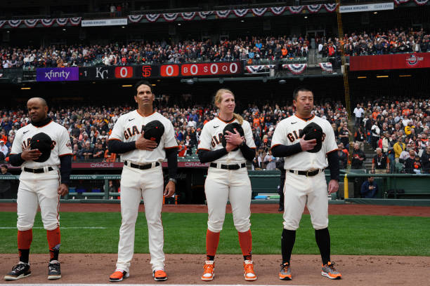 Major League Assistant Coach Alyssa Nakken of the San Francisco Giants looks on during the singing of the national anthem prior to the game between...