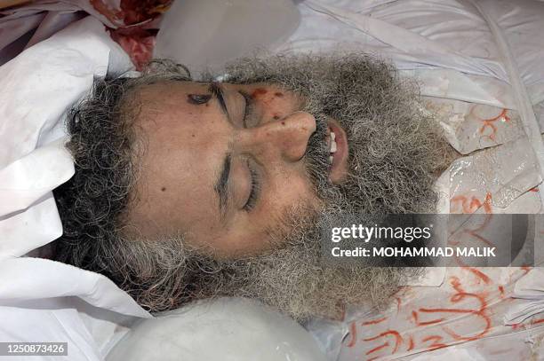 The body of Abdul Rashid Ghazi, deputy cleric of radical Red Mosque lies during his funeral in the village of Basti Abdullah, 12 July 2007, after he...