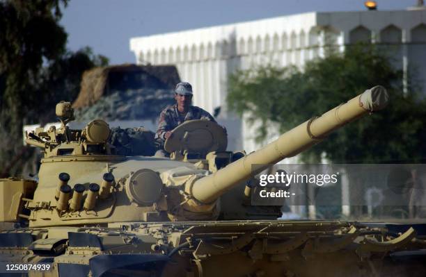 An Iraqi soldier guides a soviet-designed T-72 tank at an army compound in al-Taji, north of Baghdad, 12 November 2005. Iraq announced it had...
