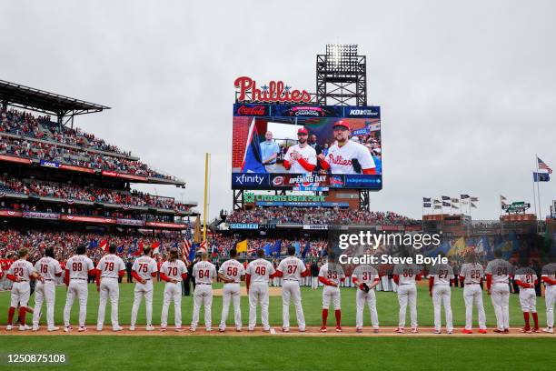 Members of the Philadelphia Phillies stand on the field prior to the game between the Cincinnati Reds and the Philadelphia Phillies at Citizens Bank...