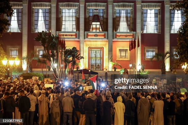 Demonstrators gather for a rally in support of Palestinians in Rabat late on April 7 following clashes between Israeli police and Palestinians inside...