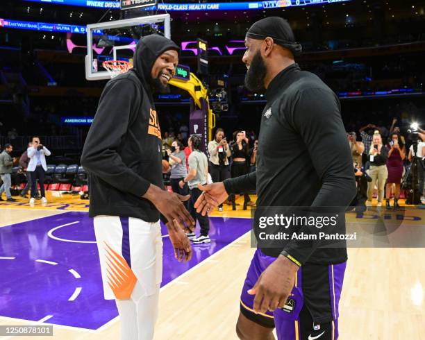 LeBron James of the Los Angeles Lakers and Kevin Durant of the Phoenix Suns embrace before the game on April 7, 2023 at Crypto.Com Arena in Los...