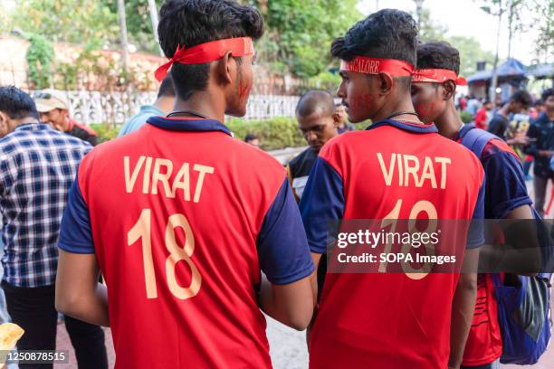 Supporters wear Virat Kohli's jersey of Royal Challengers Bangalore at Eden Garden stadium during the 2023 Indian Premier League . Final score-...