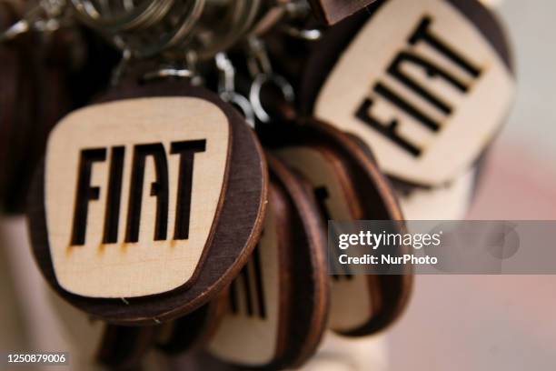 Fiat logo on a wooden keychain seen at the market on the main square in Krakow, Poland, on april 04, 2023.