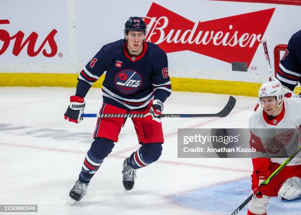 Logan Stanley of the Winnipeg Jets skates during third period action against the Detroit Red Wings at Canada Life Centre on March 31, 2023 in...