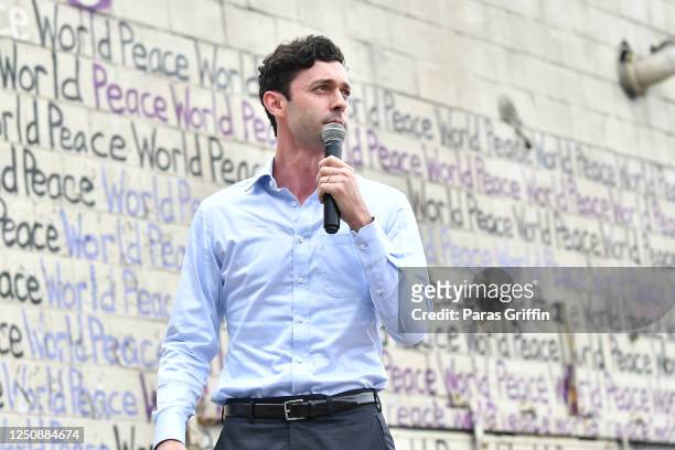 Senate candidate Jon Ossoff speaks onstage during Juneteenth Voter Registration Concert & Rally at Murphy Park Fairgrounds on June 19, 2020 in...
