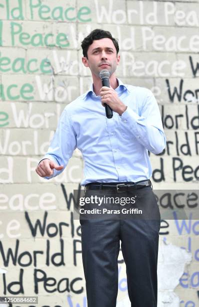 Senate candidate Jon Ossoff speaks onstage during Juneteenth Voter Registration Concert & Rally at Murphy Park Fairgrounds on June 19, 2020 in...