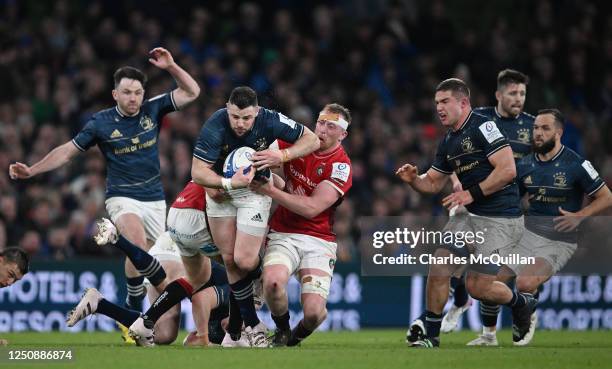 Robbie Henshaw of Leinster is tackled by Tommy Reffell of Leicester during the Heineken Champions Cup quarter final game between Leinster and...