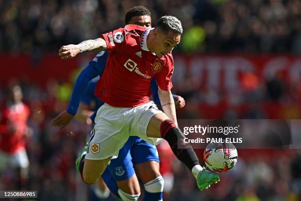 Manchester United's Brazilian midfielder Antony controls the ball during the English Premier League football match between Manchester United and...