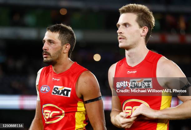 Ben Long and Noah Anderson of the Suns look dejected after a loss during the 2023 AFL Round 04 match between the St Kilda Saints and the Gold Coast...