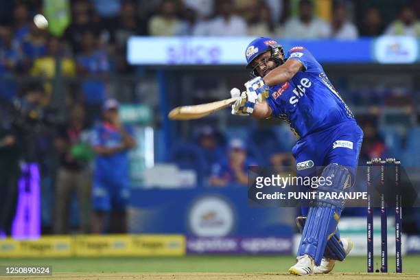 Mumbai Indians' captain Rohit Sharma plays a shot during the Indian Premier League Twenty20 cricket match between Mumbai Indians and Chennai Super...