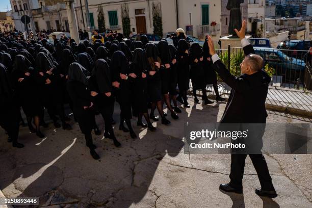 Three hundred women dressed in black with their faces covered in procession in Canosa di Puglia, April 8, 2023. In Canosa di Puglia, Holy Saturday...