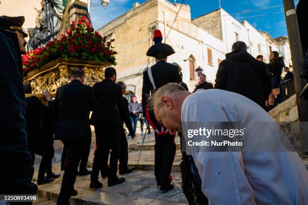 Faithful kneels before the statue of Our Lady Desolate in procession in Canosa di Puglia, April 8, 2023. In Canosa di Puglia, Holy Saturday ends with...