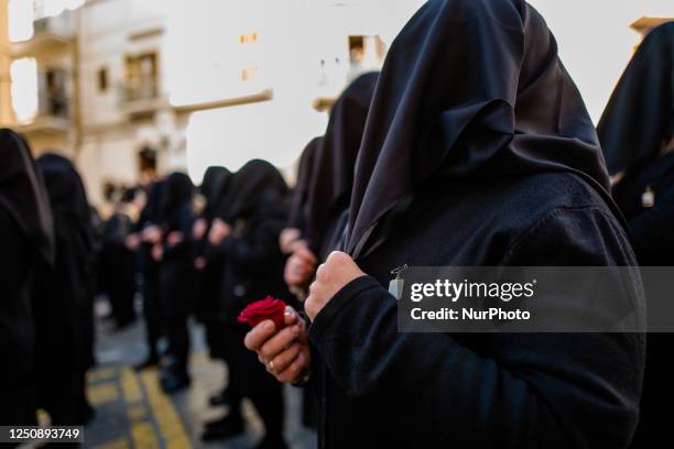 Three hundred women dressed in black with their faces covered sing the heartbreaking hymn to the Madonna Desolata in front of the Church of SS....