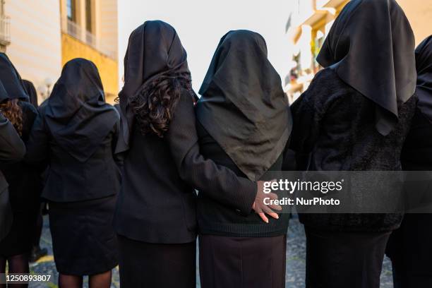 Three hundred women dressed in black with their faces covered sing the heartbreaking hymn to the Madonna Desolata in front of the Church of SS....