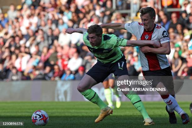 Manchester City's Belgian midfielder Kevin De Bruyne vies with Southampton's English midfielder James Ward-Prowse during the English Premier League...