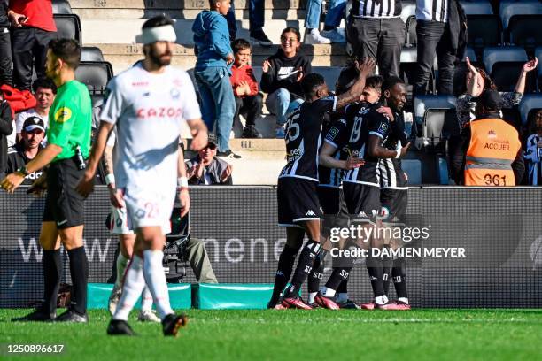 Angers' players celebrate after scoring the opening goal during the French L1 football match between SCO Angers and Lille LOSC at The Raymond-Kopa...