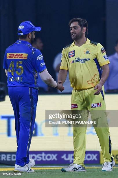 Chennai Super Kings' captain Mahendra Singh Dhoni greets Mumbai Indians' captain Rohit Sharma at the end of the Indian Premier League Twenty20...