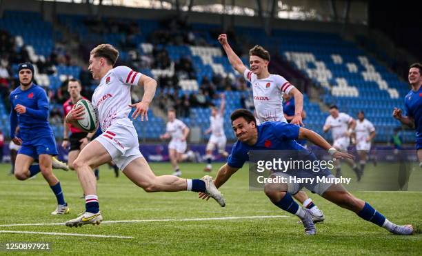 Dublin , Ireland - 8 April 2023; Jack Bracken of England evades the tackle of Kalvin Gourgues of France on his way to scoring his side's first try...