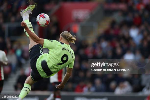 Manchester City's Norwegian striker Erling Haaland scores their third goal with this overhead kick during the English Premier League football match...
