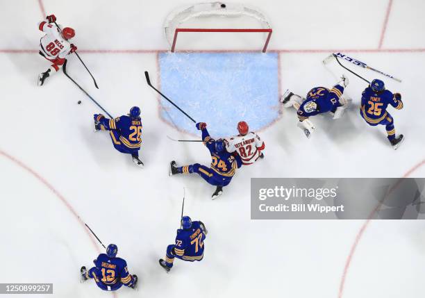 Rasmus Dahlin of the Buffalo Sabres blocks a shot by Martin Necas of the Carolina Hurricanes during an NHL game on April 8, 2023 at KeyBank Center in...