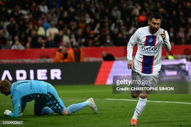 Paris Saint-Germain's Argentine forward Lionel Messi celebrates after scoring a goal during the French L1 football match between Nice and Paris...