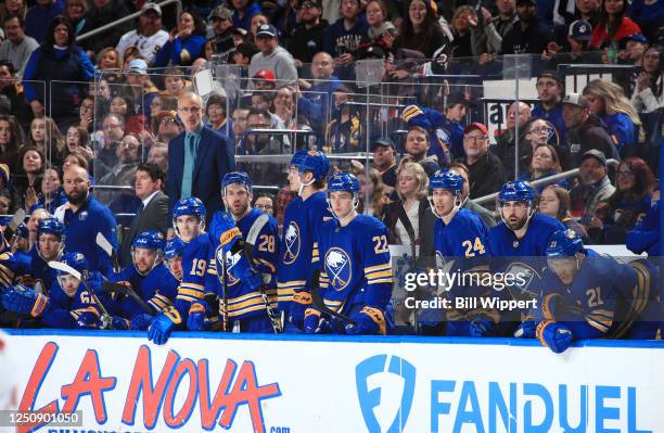 Head coach Don Granato and Buffalo Sabres players watch the closing moments of their victory against the Carolina Hurricanes in an NHL game on April...