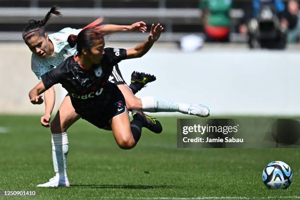 Jacqueline Ovalle of the Mexican National Team and Yuki Nagasato of the Chicago Red Stars battle for control of the ball in the first half at...