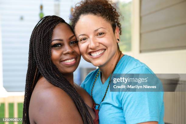 portrait of a loving lesbian couple - black lesbians kiss stock pictures, royalty-free photos & images