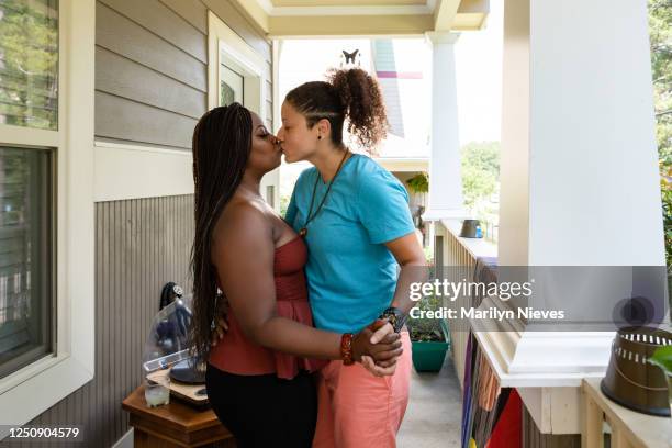 loving lesbian couple at home dancing - black lesbians kiss stock pictures, royalty-free photos & images
