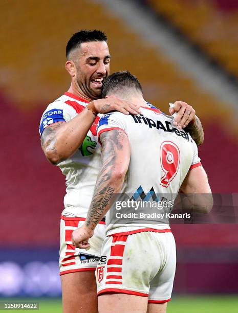 Paul Vaughan and Cameron McInnes of the Dragons celebrate victory after the round six NRL match between the Gold Coast Titans and the St George...