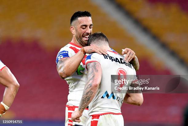 Paul Vaughan and Cameron McInnes of the Dragons celebrate victory after the round six NRL match between the Gold Coast Titans and the St George...