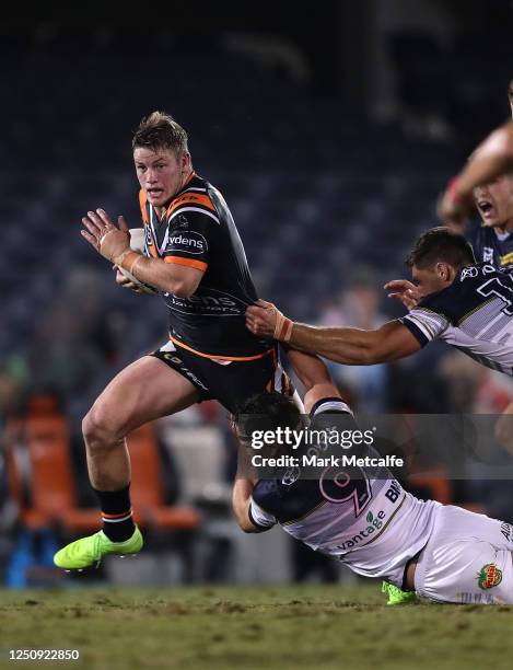 Harry Grant of the Tigers makes a break during the round six NRL match between the Wests Tigers and the North Queensland Cowboys at Campbelltown...