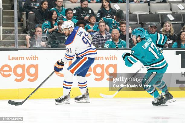 Evander Kane of the Edmonton Oilers skates with the puck in the first period against Thomas Bordeleau of the San Jose Sharks at SAP Center on April...