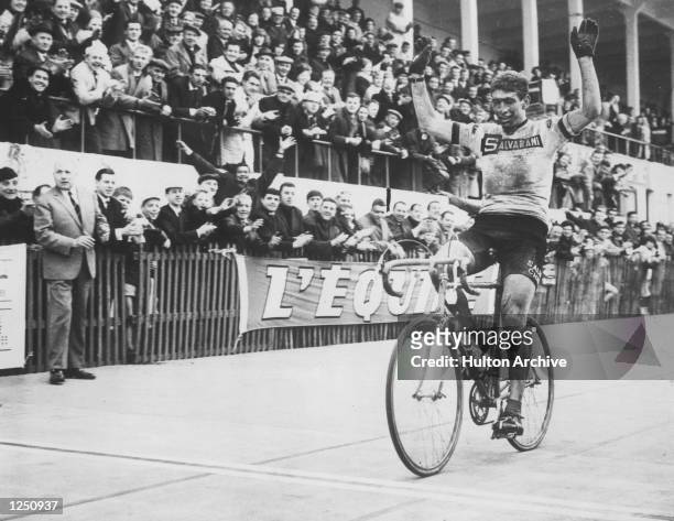 Italian cyclist Felice Gimondi throws up his arms in celebration after crossing the line to win the Paris-Roubaix one day race. Mandatory Credit:...