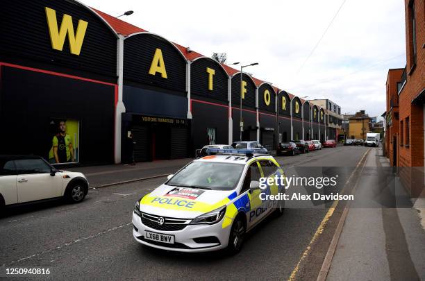 Police car is seen outside the stadium prior to the Premier League match between Watford FC and Leicester City at Vicarage Road on June 20, 2020 in...