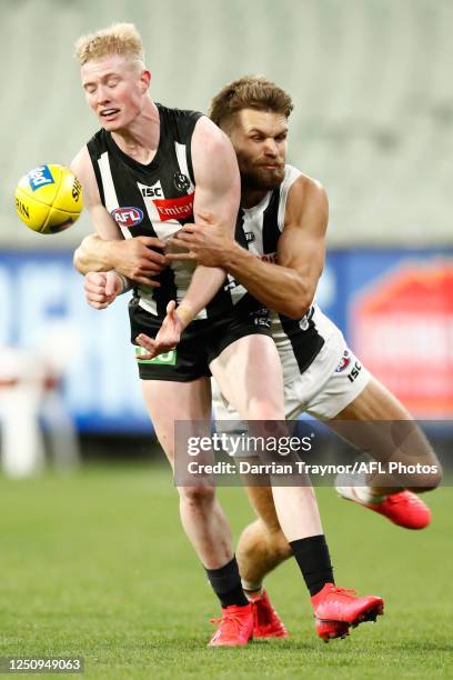 Dan Butler of the Saints tackles John Noble of the Magpies during the round 3 AFL match between the Collingwood Magpies and the St Kilda Saints at...