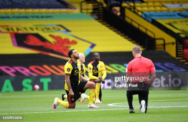 Troy Deeney of Watford takes a knee in support of the Black Lives Matter movement prior to the Premier League match between Watford FC and Leicester...