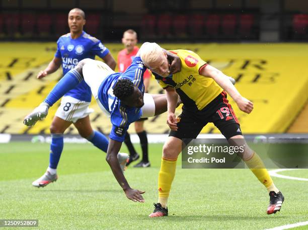 Wilfred Ndidi of Leicester City battles for possession with Will Hughes of Watford during the Premier League match between Watford FC and Leicester...