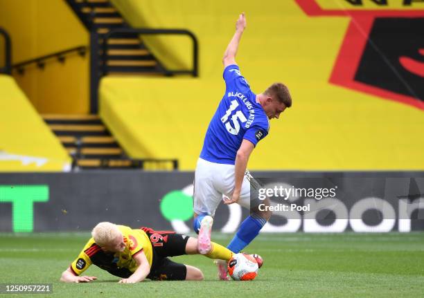 Harvey Barnes of Leicester City is challenged by Will Hughes of Watford during the Premier League match between Watford FC and Leicester City at...
