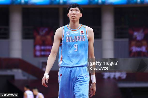 Zhou Qi of Xinjiang Flying Tigers reacts during 2019/2020 Chinese Basketball Association League match between Qingdao Eagles and Xinjiang Flying...