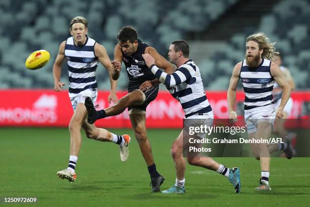 Jack Martin of the Blues kicks ahead during the round 3 AFL match between the Geelong Cats and the Carlton Blues at GMHBA Stadium on June 20, 2020 in...