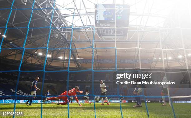 Joao Victor of VfL Wolfsburg scores a goal past Alexander Nuebel FC Schalke 04during the Bundesliga match between FC Schalke 04 and VfL Wolfsburg at...