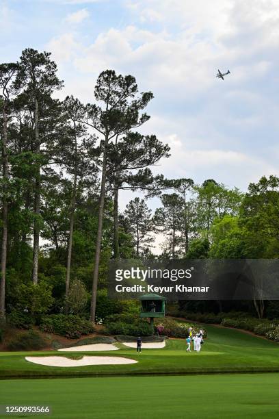 Scenic view as a Wheels Up plane flies over the 12th hole during the first round of the 2023 Masters Tournament at Augusta National Golf Club on...
