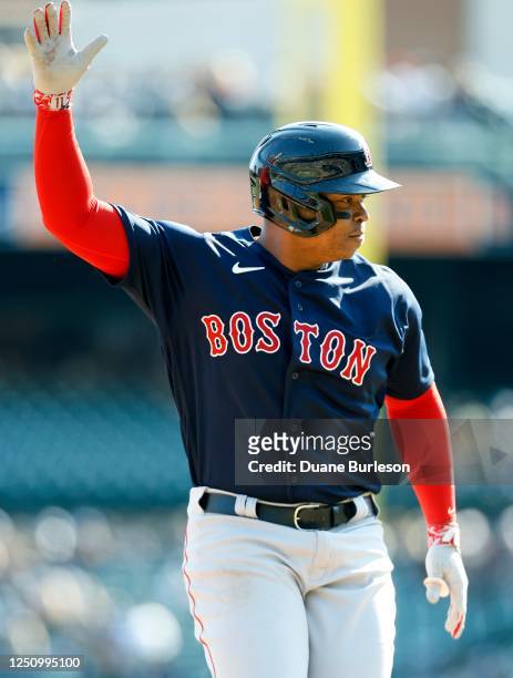 Rafael Devers of the Boston Red Sox celebrates while rounding the bases after hitting a grand slam against the Detroit Tigers during the second...