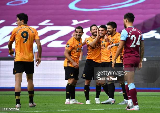 Pedro Neto of Wolverhampton Wanderers celebrates with his team mates after scoring his team's second goal during the Premier League match between...