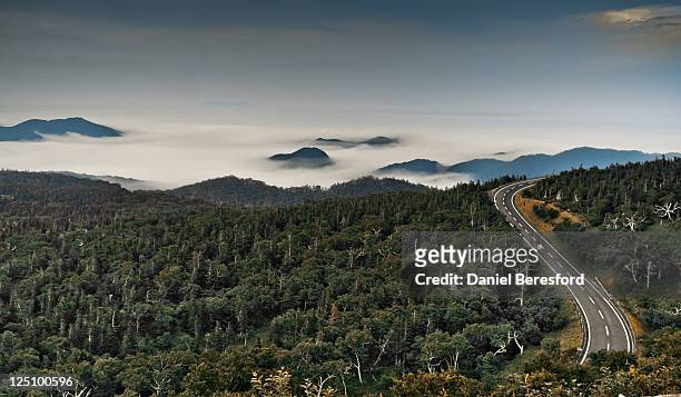 road though mountainous - shiretoko stock pictures, royalty-free photos & images