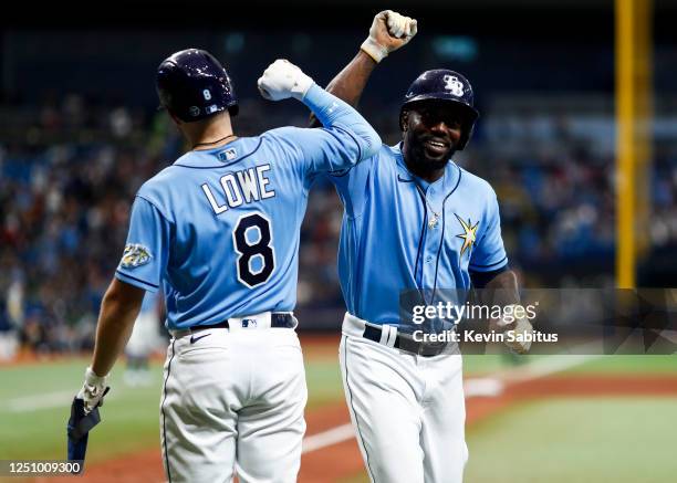 Randy Arozarena of the Tampa Bay Rays celebrates with Brandon Lowe after hitting a home run during the eighth inning against the Oakland Athletics at...