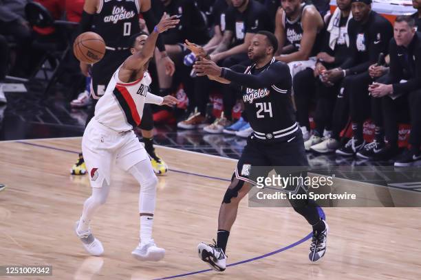 Clippers guard Norman Powell pass the ball during the Portland Trail Blazers versus the Los Angele Clippers game on April 08 at Crypto.com Arena in...
