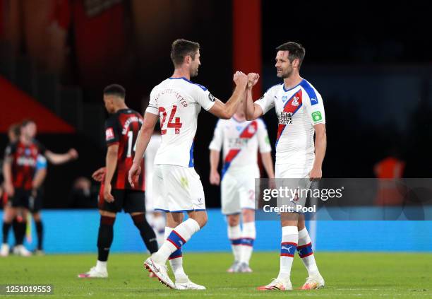 Gary Cahill of Crystal Palace and Scott Dann of Crystal Palace interact following their victory in the Premier League match between AFC Bournemouth...